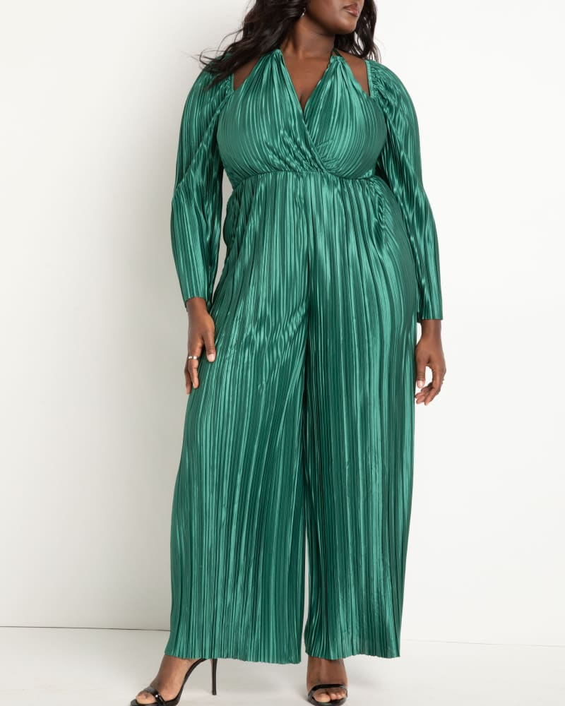 Front of a model wearing a size 28 Plisse Jumpsuit With Strap Detail in Green by ELOQUII. | dia_product_style_image_id:272959